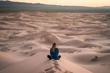 Woman in sand dune